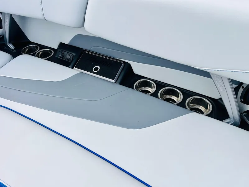 Slide: The Image of Interior of 2020 Malibu Wakesetter 24 MXZ with cup holders and sleek seating design. - 35