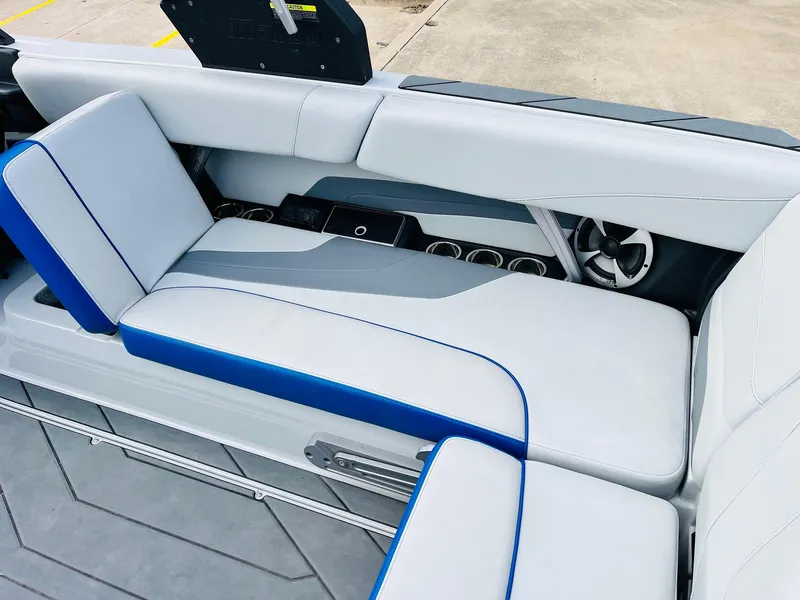 Slide: The Image of 2020 Malibu Wakesetter 24 MXZ interior seating with cup holders and sleek design. - 37