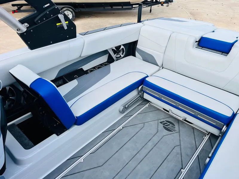 Slide: The Image of 2020 Malibu Wakesetter 24 MXZ interior with blue and white seating. - 38