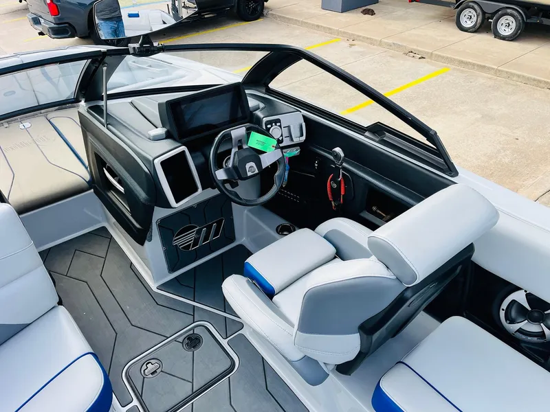 Slide: The Image of 2020 Malibu Wakesetter 24 MXZ boat interior with modern dashboard and seating. - 39