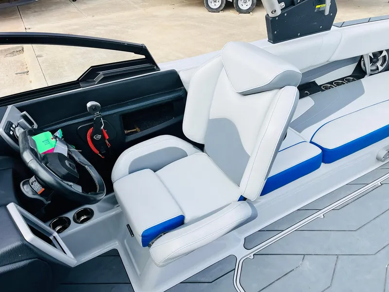 Slide: The Image of 2020 Malibu Wakesetter 24 MXZ interior with sleek seating and modern dashboard. - 40