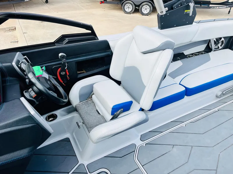 Slide: The Image of 2020 Malibu Wakesetter 24 MXZ interior with sleek seating and modern dashboard design. - 41