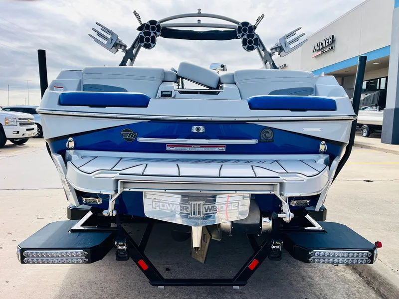 Slide: The Image of 2020 Malibu Wakesetter 24 MXZ boat, rear view, showcasing wakeboard tower and swim platform. - 6