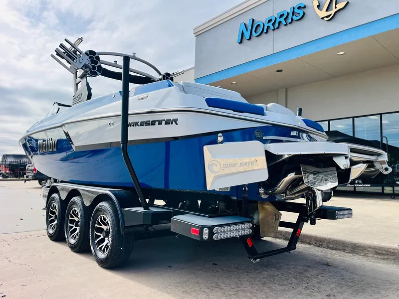 Slide: The Image of 2020 Malibu Wakesetter 24 MXZ boat on trailer outside Norris dealership. - 7