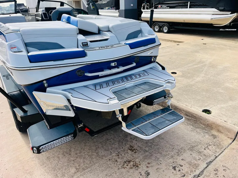 Slide: The Image of 2020 Malibu Wakesetter 24 MXZ boat with swim platform and step ladder. - 8