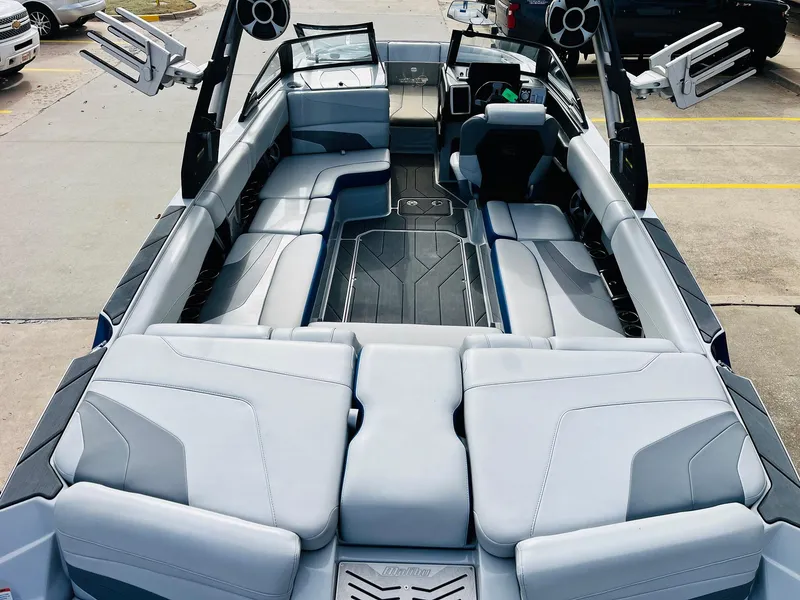Slide: The Image of 2020 Malibu Wakesetter 24 MXZ interior with spacious seating and modern design. - 9