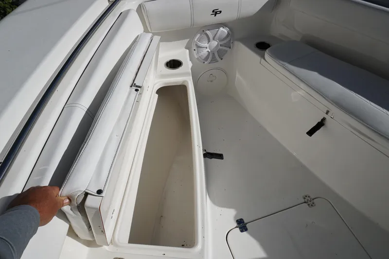 Slide: The Image of 2021 Sea Pro 259 Center Console boat interior with storage compartment open. - 12