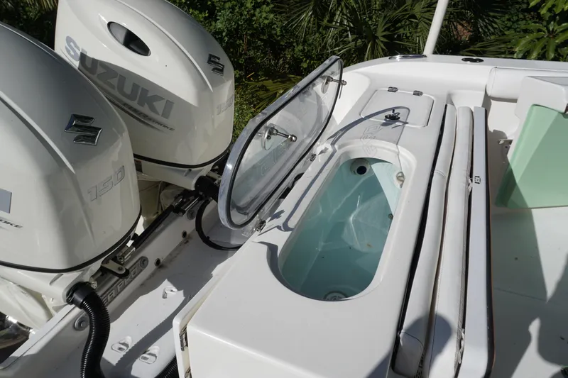 Slide: The Image of 2021 Sea Pro 259 Center Console with Suzuki engines and open livewell. - 15