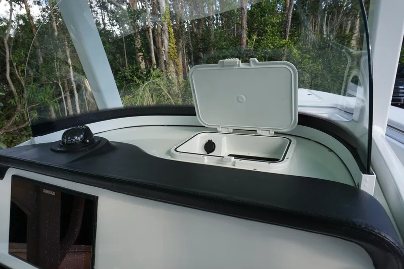 Slide: The Image of 2021 Sea Pro 259 Center Console boat interior with open storage compartment. - 6