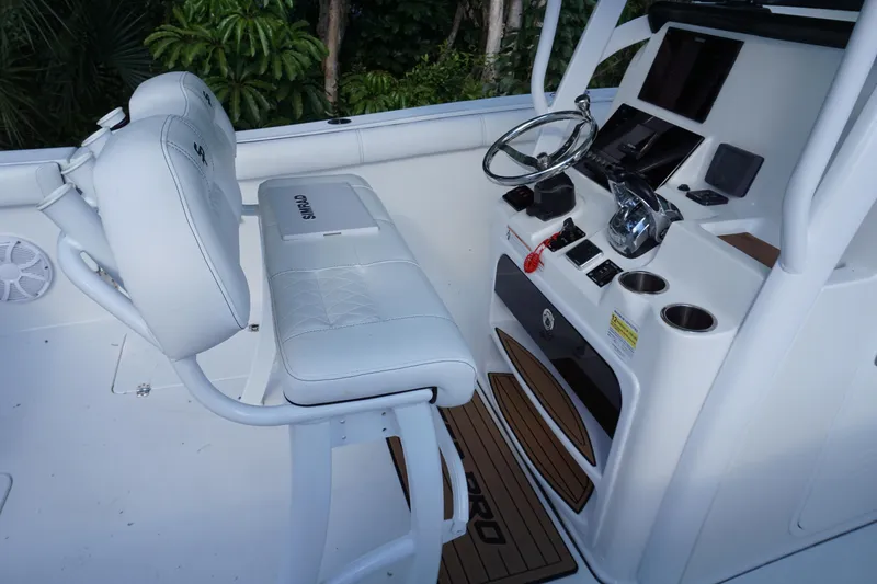 Slide: The Image of 2021 Sea Pro 259 Center Console boat interior with helm and seating. - 7