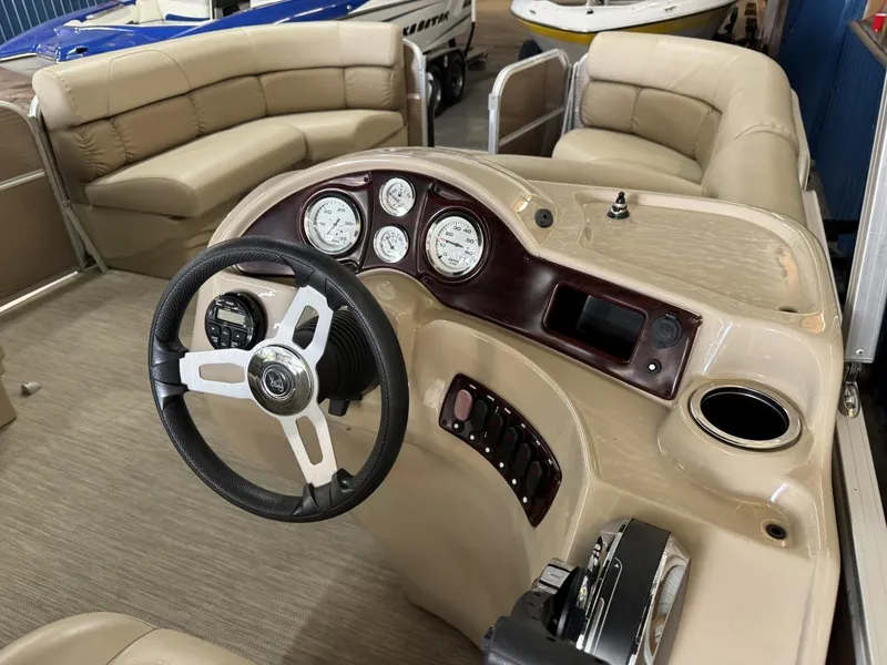Slide: The Image of 2018 Misty Harbor 2085 Adventure CR boat interior with steering wheel and gauges. - 8