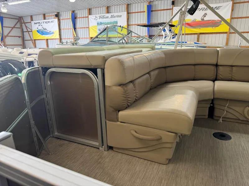 Slide: The Image of 2018 Misty Harbor 2085 Adventure CR pontoon boat with beige seating in showroom. - 9