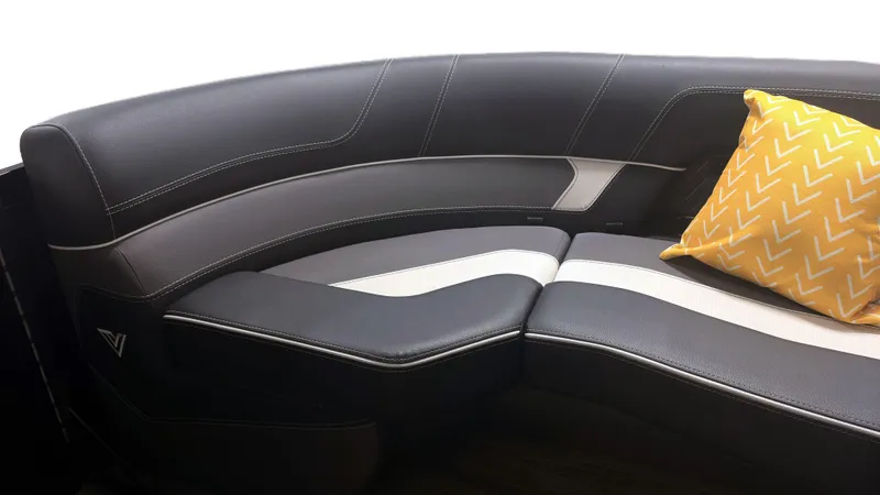 Slide: The Image of 2024 Viaggio Diamante U boat seating with black and white upholstery, accented by a yellow pillow. - 4