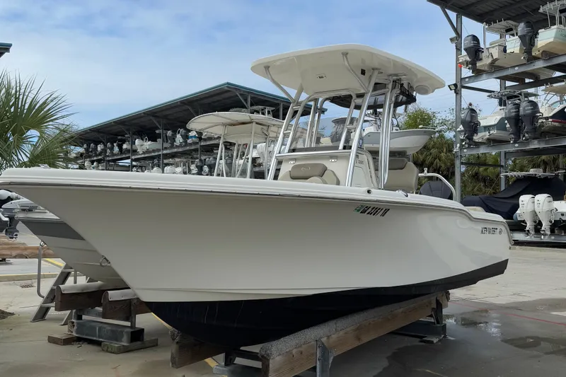 The Image of 2021 Key West 239 FS boat on display in a marina. - 0
