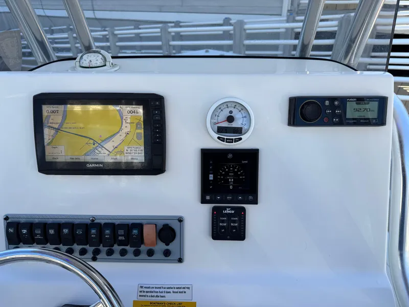 Slide: The Image of Dashboard of 2021 Key West 239 FS boat with navigation and control instruments. - 6