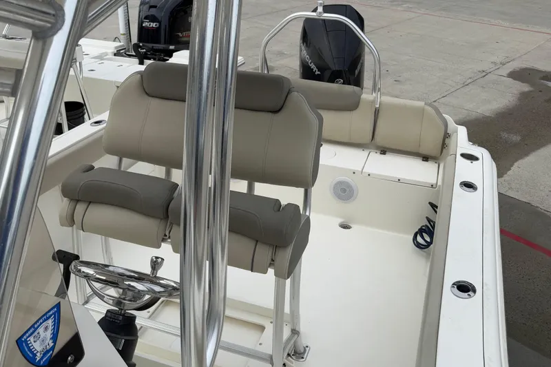 Slide: The Image of 2021 Key West 239 FS boat interior with seating and steering wheel. - 7