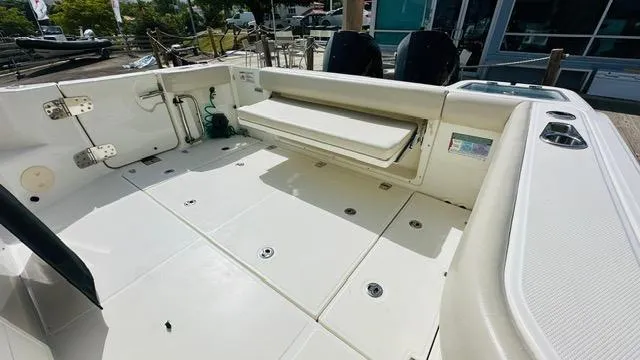 Slide: The Image of 2023 Boston Whaler 325 boat deck with seating and storage compartments. - 5