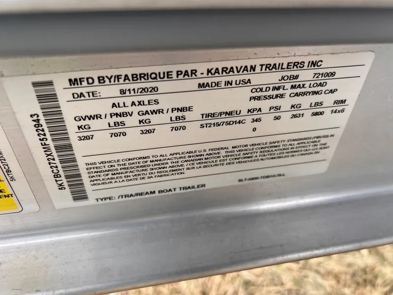 Slide: The Image of Label on Karavan trailer, manufactured 2020, showing weight and tire specifications. - 16
