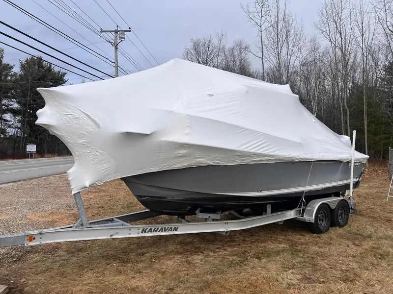 Slide: The Image of 2016 Steiger Craft 23 Miami boat covered on trailer, parked outdoors. - 18