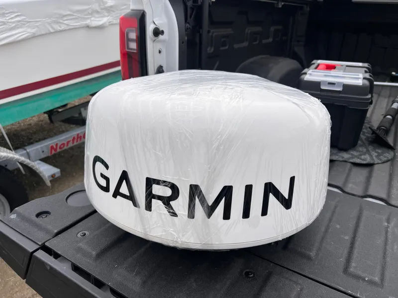 Slide: The Image of Garmin radar dome on truck bed, Steiger Craft 23 Miami, 2016 model nearby. - 22