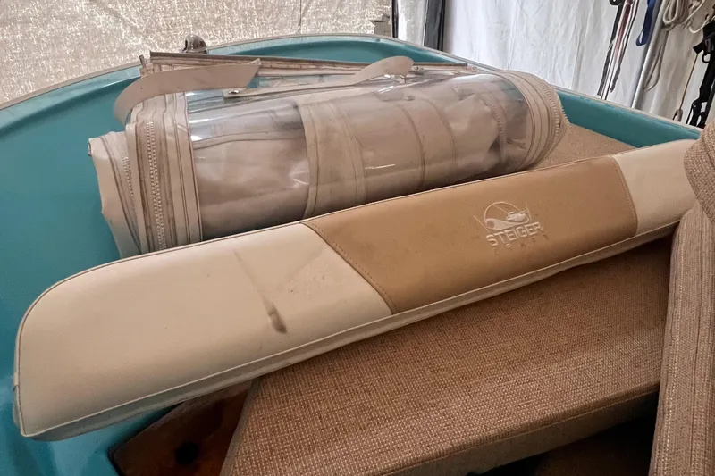 Slide: The Image of Steiger Craft 23 Miami 2016 boat interior with cushions and storage bag. - 23