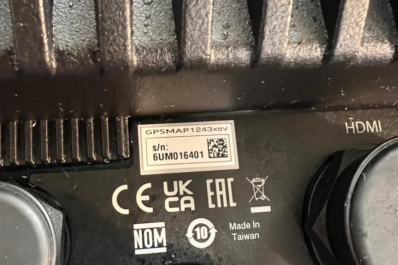 Slide: The Image of Close-up of a GPSMAP 1243xsv serial number label on electronic device. - 26