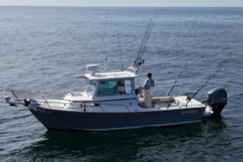 Slide: The Image of 2016 Steiger Craft 23 Miami boat on open water, equipped for fishing. - 6