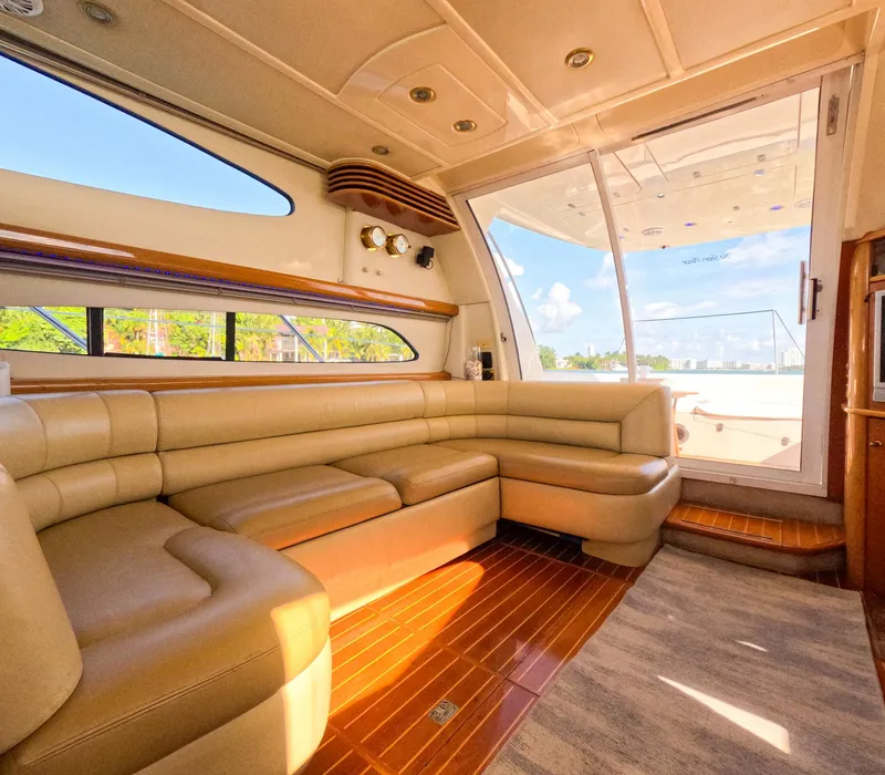 Slide: The Image of Luxurious interior of a 2004 Sealine 47 yacht with plush seating and wooden flooring. - 15