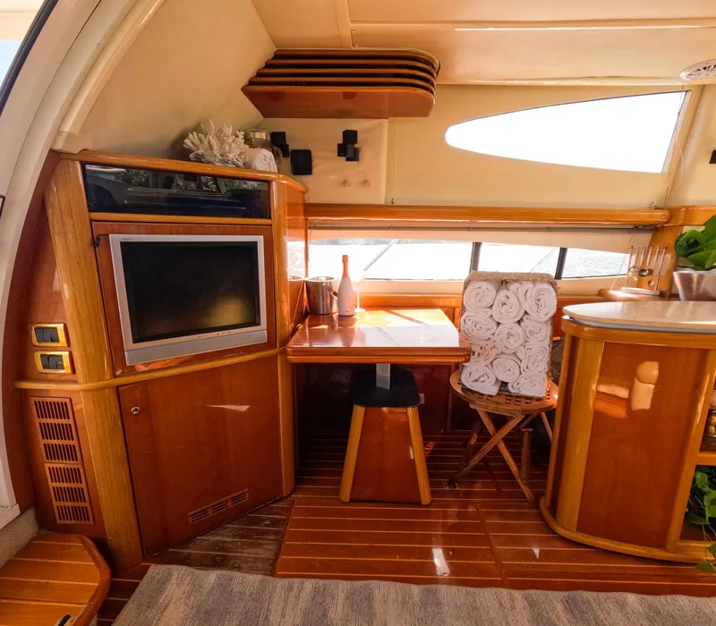 Slide: The Image of Luxurious interior of 2004 Sealine 47 yacht with wood finishes and modern amenities. - 17