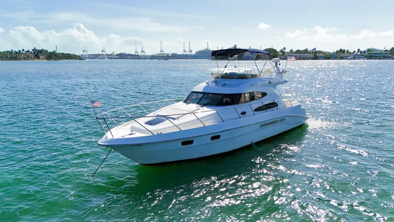 Slide: The Image of 2004 Sealine 47 yacht cruising on a sunny day in open waters. - 2