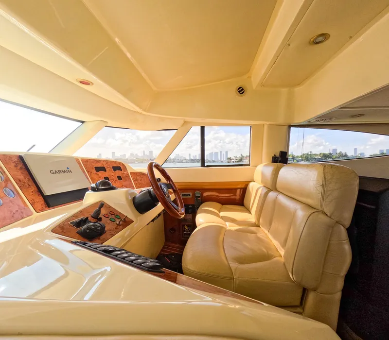 Slide: The Image of Luxurious interior of 2004 Sealine 47 yacht with leather seating and navigation controls. - 20