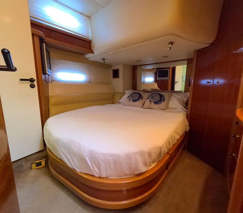 Slide: The Image of Luxurious bedroom interior of a 2004 Sealine 47 yacht with cozy double bed. - 25