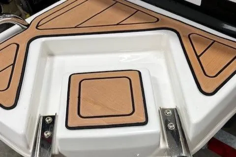 Slide: The Image of Bayliner Element E18 2023 boat deck with wood accents and stainless steel fittings. - 5