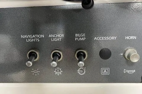 Slide: The Image of Control panel of 2023 Bayliner Element E18 with switches for lights, bilge pump, and horn. - 6