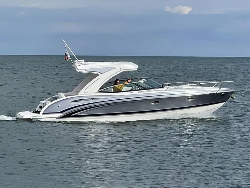 The Image of 2026 Formula 310 Sun Sport boat cruising on open water. - 10