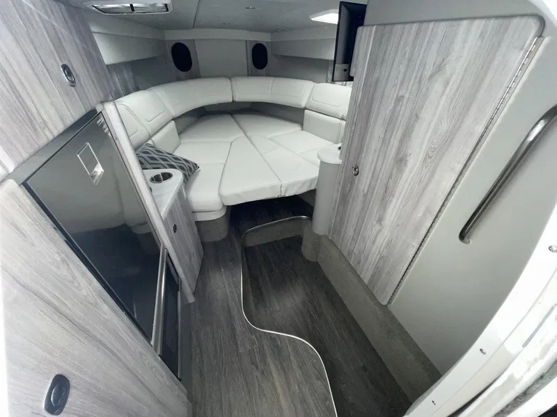 Slide: The Image of 2026 Formula 310 Sun Sport cabin interior with modern design and comfortable seating. - 14