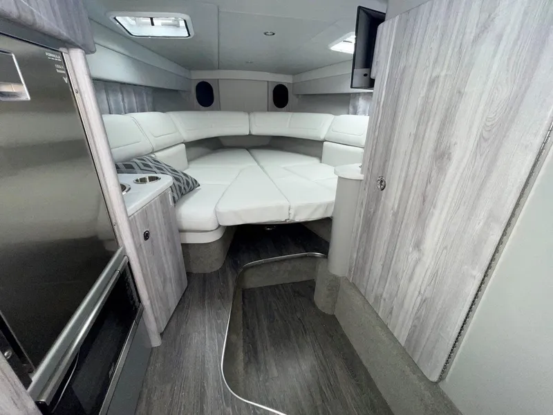 Slide: The Image of 2026 Formula 310 Sun Sport cabin interior with modern design and comfortable seating. - 15