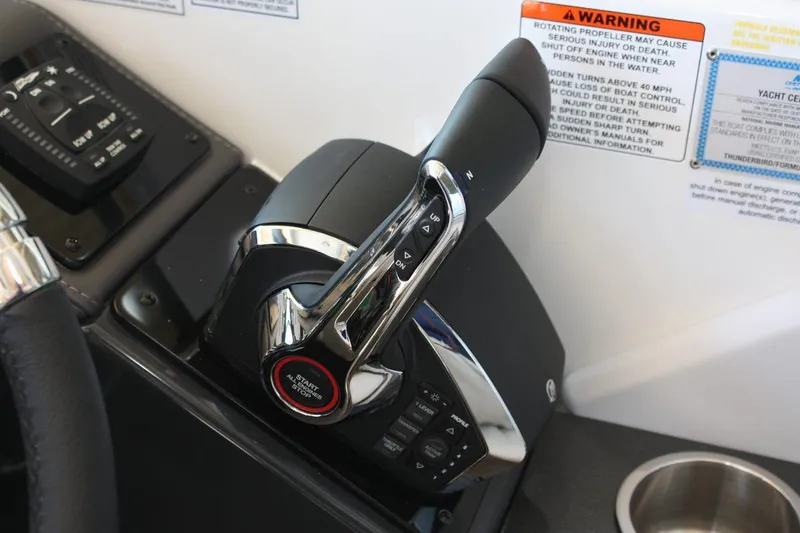 Slide: The Image of Throttle control of 2026 Formula 310 Sun Sport boat, featuring sleek design and warning labels. - 23