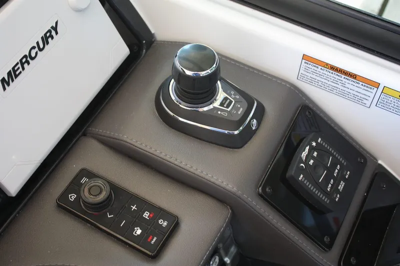 Slide: The Image of Control panel of 2026 Formula 310 Sun Sport boat with Mercury joystick and controls. - 24