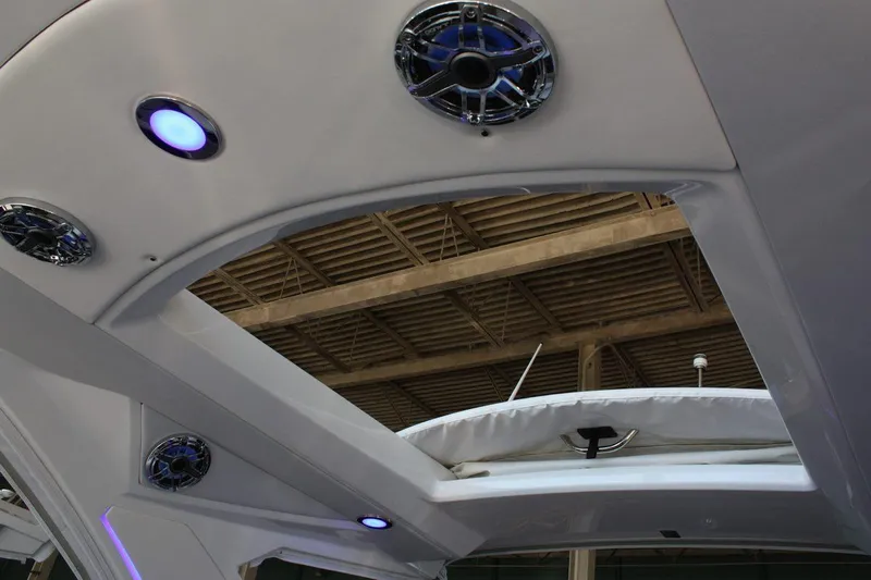 Slide: The Image of 2026 Formula 310 Sun Sport boat interior with blue LED lights and speakers. - 30