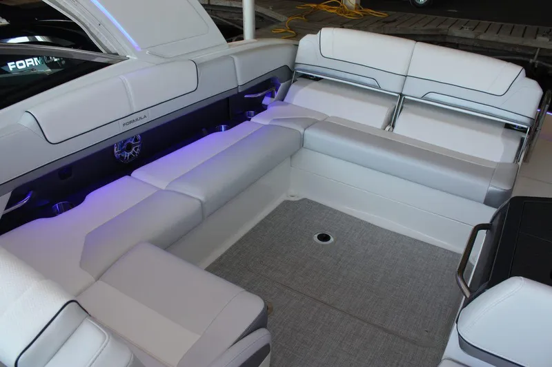 Slide: The Image of Luxurious seating area on 2026 Formula 310 Sun Sport boat with ambient lighting. - 32