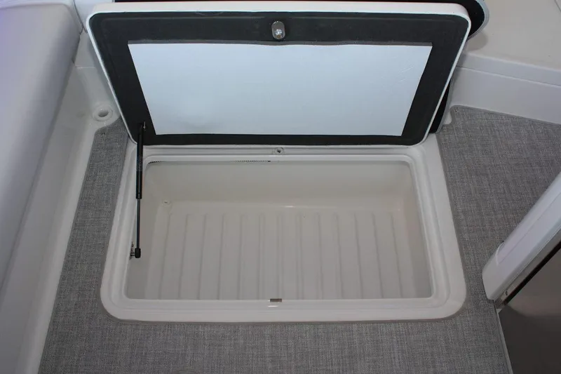 Slide: The Image of Open storage compartment on 2026 Formula 310 Sun Sport boat, featuring a spacious interior. - 38