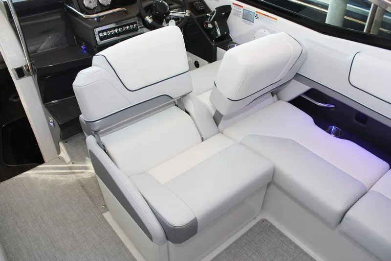 Slide: The Image of 2026 Formula 310 Sun Sport boat interior with luxurious white seating and modern dashboard. - 43