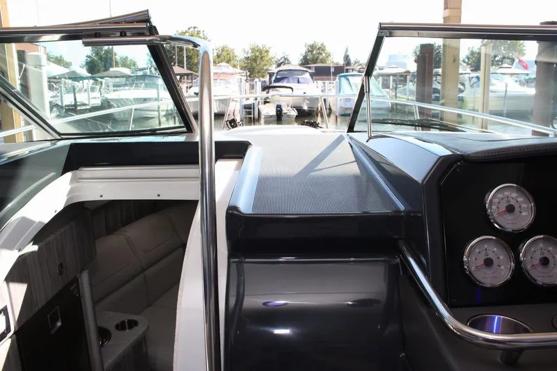 Slide: The Image of 2026 Formula 310 Sun Sport boat interior with sleek dashboard and comfortable seating. - 45