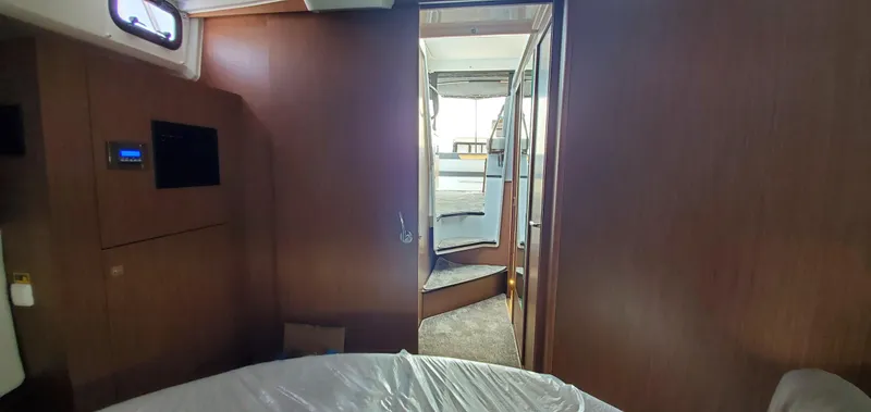 Slide: The Image of 2025 Jeanneau NC 1095 Weekender cabin interior with modern design and ample natural light. - 27