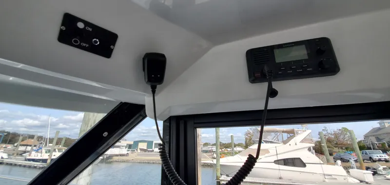 Slide: The Image of 2025 Jeanneau NC 1095 Weekender cabin interior with cushions and storage. - 30