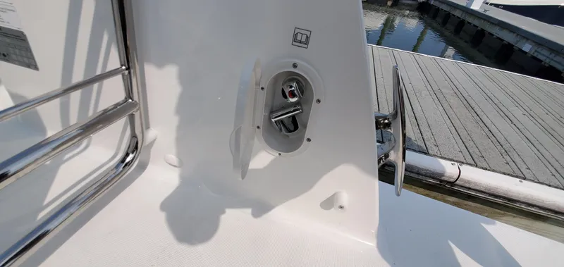 Slide: The Image of Woman relaxing on Jeanneau NC 1095 Weekender 2025, reading by the water. - 44