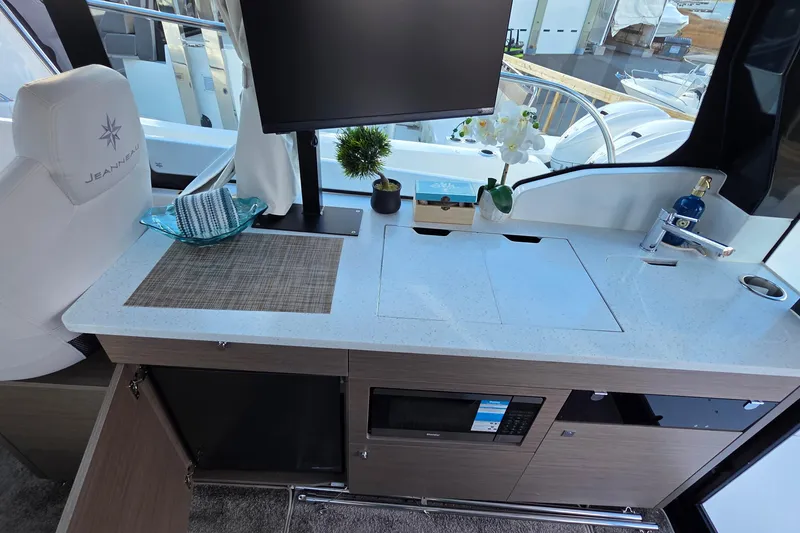 Slide: The Image of Interior of 2026 Jeanneau NC 1095 Coupe with modern kitchen amenities. - 74