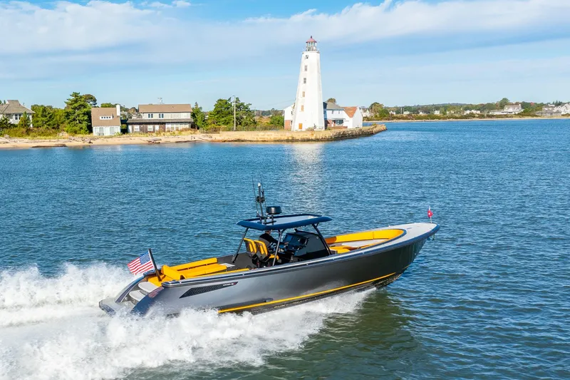 Slide: The Image of 2025 Wajer 38s yacht cruising near a lighthouse on a sunny day. - 0