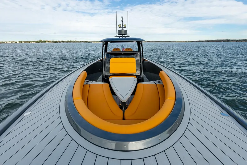 Slide: The Image of 2025 Wajer 38s luxury yacht with sleek design and vibrant orange seating on open water. - 10
